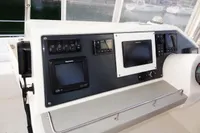 Control panel of a 2018 Leopard 43 Powercat with navigation screens and instruments.