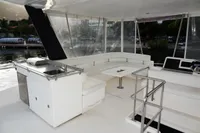 2018 Leopard 43 Powercat yacht interior with seating and kitchenette.