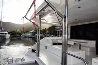 2018 Leopard 43 Powercat docked at a marina with scenic mountain backdrop.