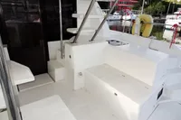 2018 Leopard 43 Powercat boat interior with white seating and storage compartments.