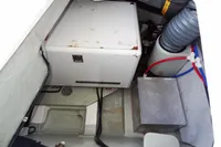 Engine compartment of a 2018 Leopard 43 Powercat with generator and wiring.