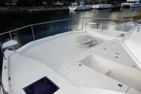 2018 Leopard 43 Powercat bow deck with storage compartments and waterfront view.