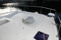 2018 Leopard 43 Powercat boat deck with railing and covered equipment.