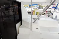 2018 Leopard 43 Powercat yacht interior with stairs and marina view.