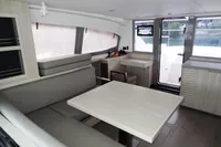 Interior of 2018 Leopard 43 Powercat with modern seating and dining area.