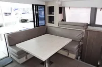 2018 Leopard 43 Powercat interior dining area with modern seating and table.