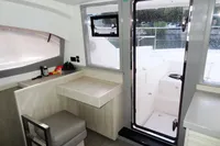 Interior of 2018 Leopard 43 Powercat with desk, chair, and door to deck.