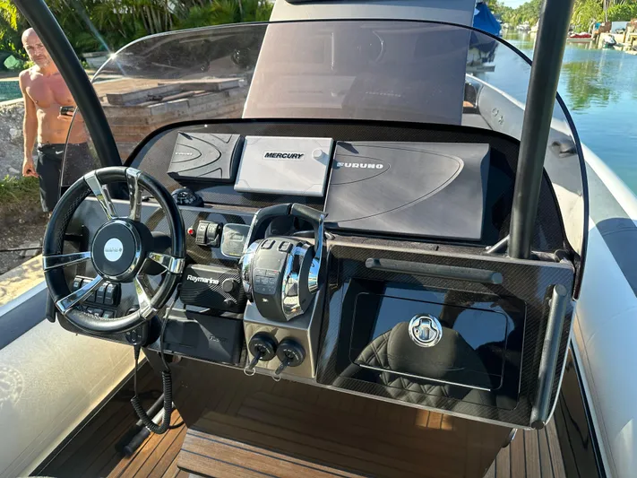  Yacht Photos Pics 2020 Technohull SEADNA 999 G5 ST dashboard with steering wheel and navigation controls.