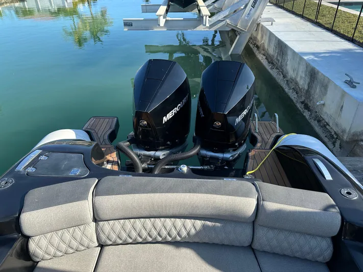  Yacht Photos Pics 2020 Technohull SEADNA 999 G5 ST with dual Mercury outboard engines, docked by the water.