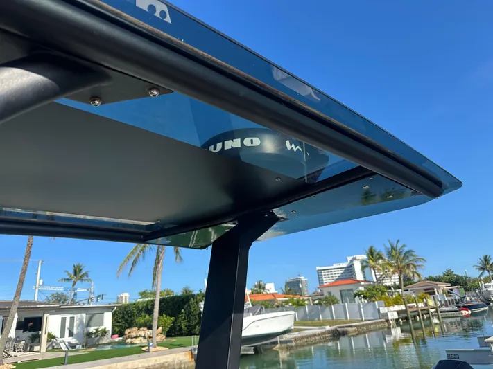  Yacht Photos Pics 2020 Technohull SEADNA 999 G5 ST boat canopy with scenic waterfront view.