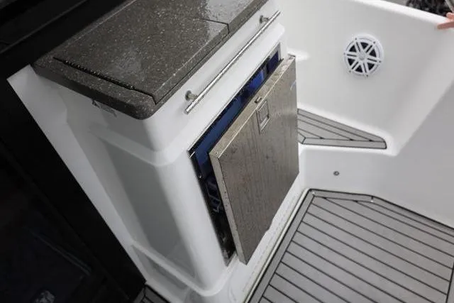  Yacht Photos Pics 2021 Four Winns V355 Coupe boat interior with open storage compartment and sleek flooring.