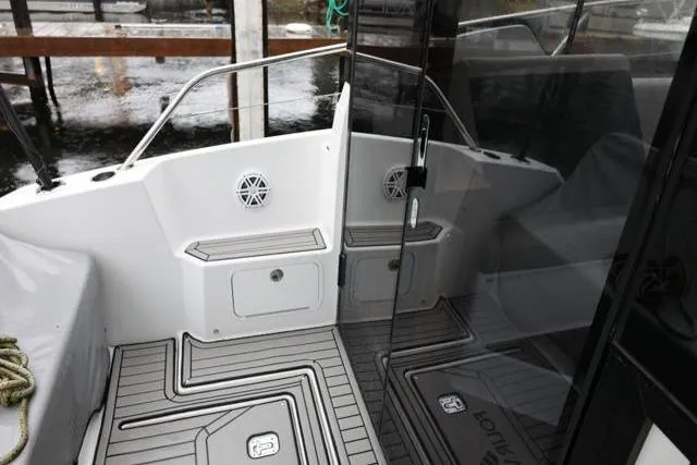  Yacht Photos Pics 2021 Four Winns V355 Coupe boat deck with sleek design and modern features.