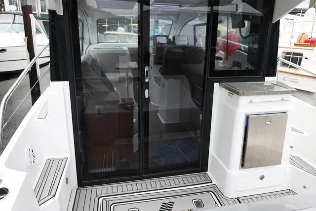  Yacht Photos Pics 2021 Four Winns V355 Coupe boat with sleek cockpit and modern interior design.