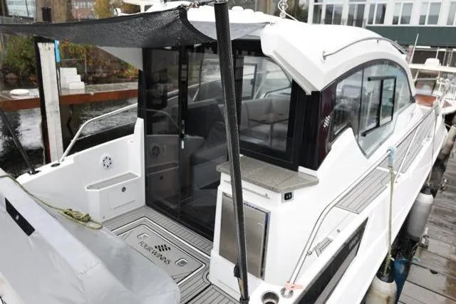  Yacht Photos Pics 2021 Four Winns V355 Coupe boat docked, showcasing sleek design and modern features.