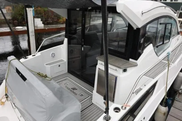  Yacht Photos Pics 2021 Four Winns V355 Coupe yacht docked, featuring sleek design and modern amenities.