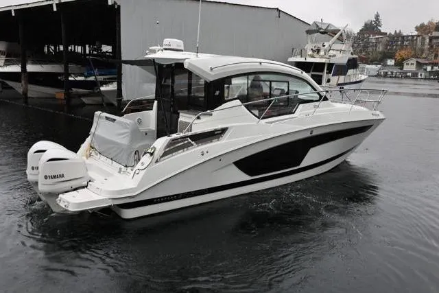  Yacht Photos Pics 2021 Four Winns V355 Coupe boat with Yamaha engines docked in a marina.