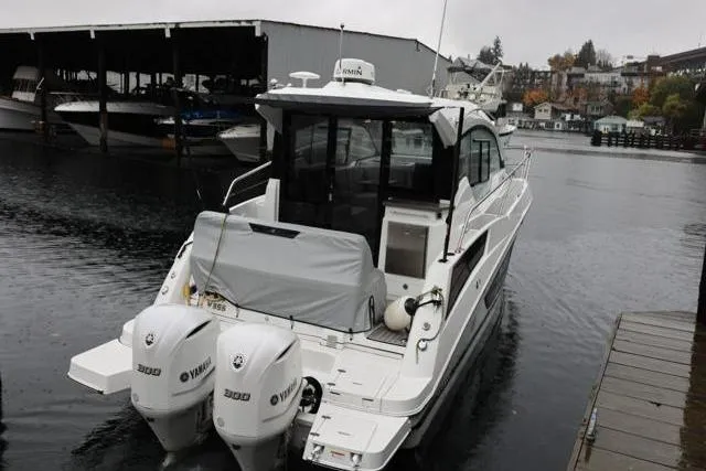  Yacht Photos Pics 2021 Four Winns V355 Coupe boat docked with twin Yamaha 300 engines.