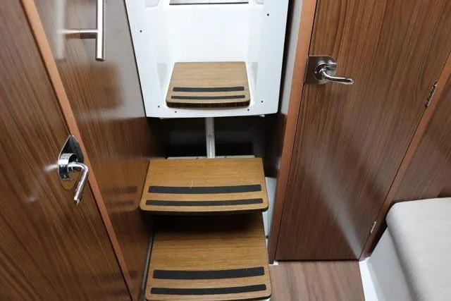  Yacht Photos Pics 2021 Four Winns V355 Coupe interior with wooden steps and modern design.