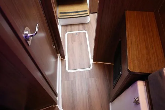  Yacht Photos Pics 2021 Four Winns V355 Coupe interior with wood flooring and modern design.