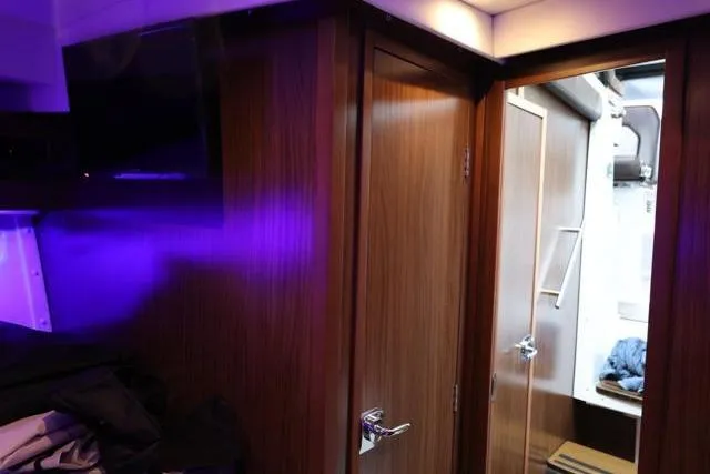  Yacht Photos Pics Interior of 2021 Four Winns V355 Coupe with modern wood finish and ambient lighting.