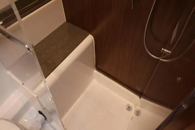  Yacht Photos Pics 2021 Four Winns V355 Coupe bathroom with modern shower and sleek design.