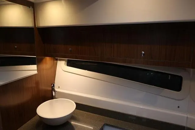  Yacht Photos Pics Interior of 2021 Four Winns V355 Coupe, featuring modern bathroom with sleek design.