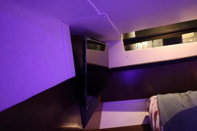  Yacht Photos Pics Interior cabin of 2021 Four Winns V355 Coupe with ambient lighting and window view.