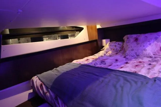  Yacht Photos Pics Cozy cabin interior of 2021 Four Winns V355 Coupe with ambient lighting.