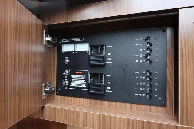  Yacht Photos Pics Electrical control panel inside 2021 Four Winns V355 Coupe yacht cabinet.