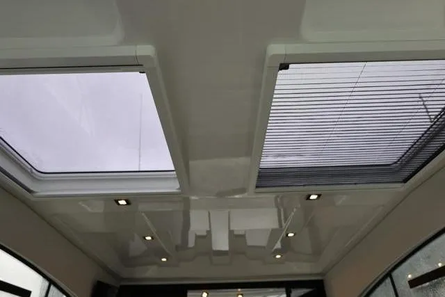  Yacht Photos Pics 2021 Four Winns V355 Coupe interior ceiling with skylights and modern lighting.