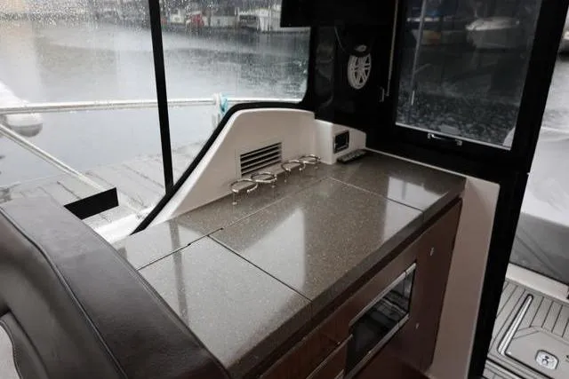  Yacht Photos Pics 2021 Four Winns V355 Coupe interior with sleek countertop and modern amenities.