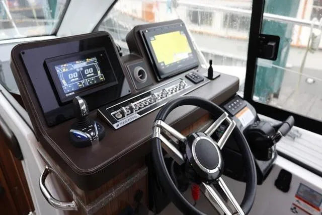  Yacht Photos Pics 2021 Four Winns V355 Coupe dashboard with modern navigation and control systems.