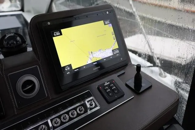  Yacht Photos Pics 2021 Four Winns V355 Coupe dashboard with navigation display and controls.