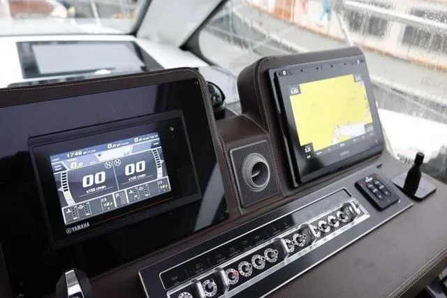 Yacht Photos Pics 2021 Four Winns V355 Coupe dashboard with navigation and control screens.
