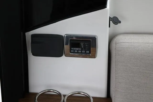  Yacht Photos Pics 2021 Four Winns V355 Coupe interior with Dometic control panel and cup holders.