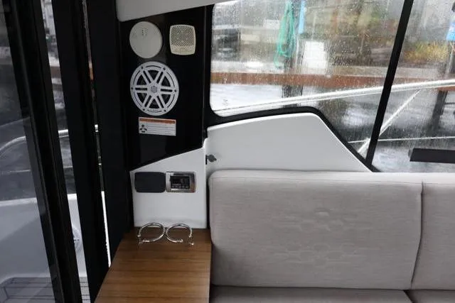  Yacht Photos Pics Interior of 2021 Four Winns V355 Coupe, featuring seating and audio system.