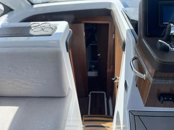  Yacht Photos Pics Interior view of 2021 Four Winns Vista 355 Coupe, showcasing cabin entrance and helm area.