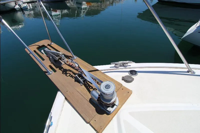  Yacht Photos Pics Bow of 1988 Ocean Yachts 38 Super Sport with anchor winch and calm marina waters.