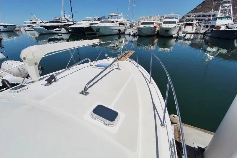  Yacht Photos Pics 1988 Ocean Yachts 38 Super Sport docked in a marina with other boats.