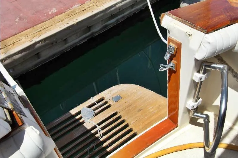  Yacht Photos Pics 1988 Ocean Yachts 38 Super Sport swim platform with wooden finish and dock view.