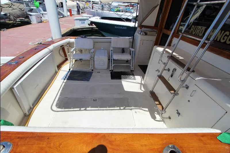  Yacht Photos Pics 1988 Ocean Yachts 38 Super Sport boat deck with chairs and ladder at marina.