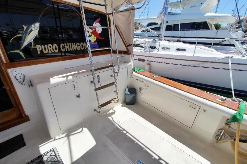  Yacht Photos Pics 1988 Ocean Yachts 38 Super Sport boat deck with ladder and marina view.