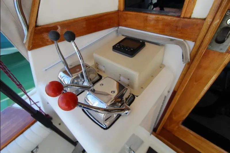  Yacht Photos Pics Control panel of 1988 Ocean Yachts 38 Super Sport with throttle levers and navigation device.