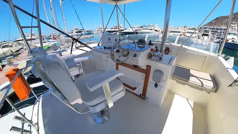  Yacht Photos Pics 1988 Ocean Yachts 38 Super Sport cockpit with helm, seating, and marina view.