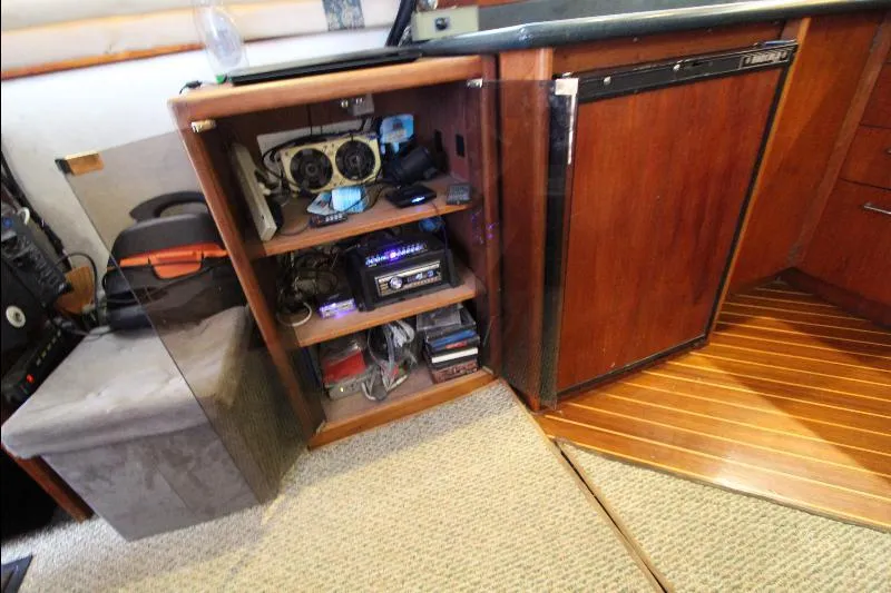  Yacht Photos Pics 1988 Ocean Yachts 38 Super Sport interior with open cabinet and electronic equipment.