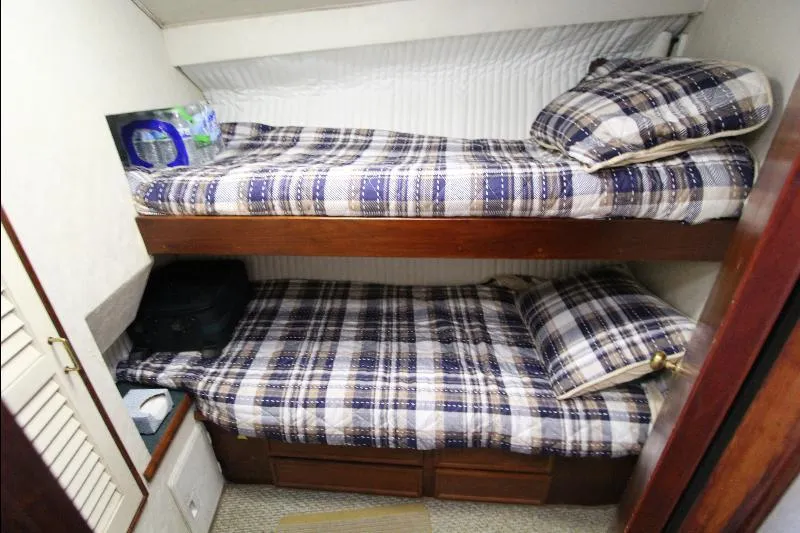  Yacht Photos Pics Bunk beds in 1988 Ocean Yachts 38 Super Sport cabin with plaid bedding.