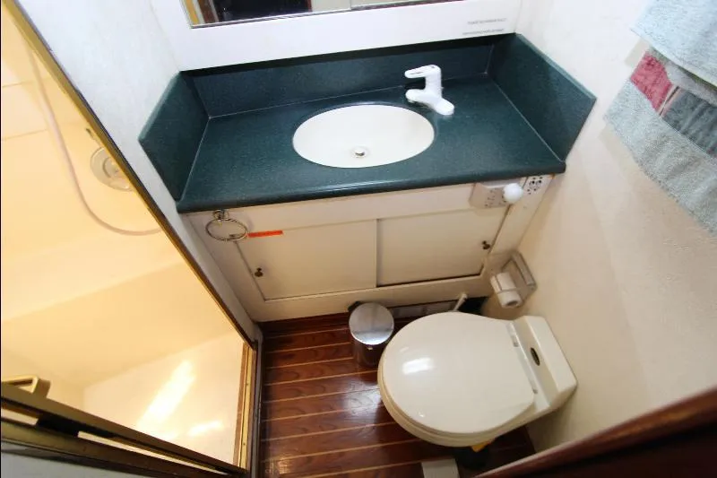  Yacht Photos Pics Bathroom interior of 1988 Ocean Yachts 38 Super Sport with sink and toilet.