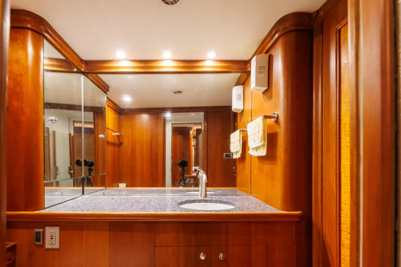 Stress Relief Yacht Photos Pics Luxurious wooden bathroom interior on 2003 Tiffany Enclosed Bridge Sport fish yacht.