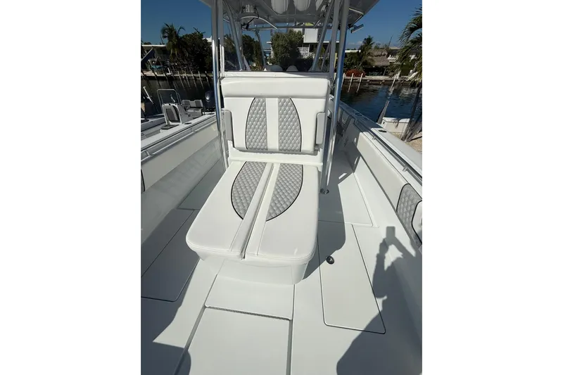 Dig It Yacht Photos Pics 2022 Contender 39 ST boat interior with cushioned seating and sleek design.