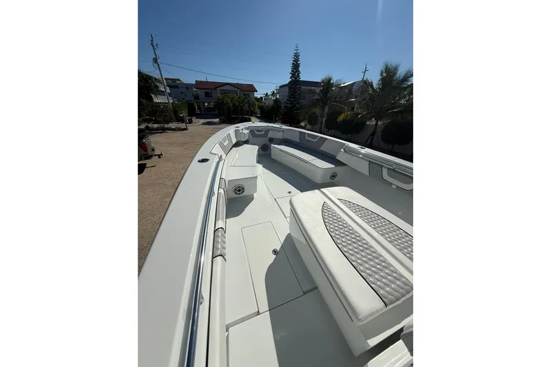 Dig It Yacht Photos Pics 2022 Contender 39 ST boat interior with cushioned seating and sleek design.